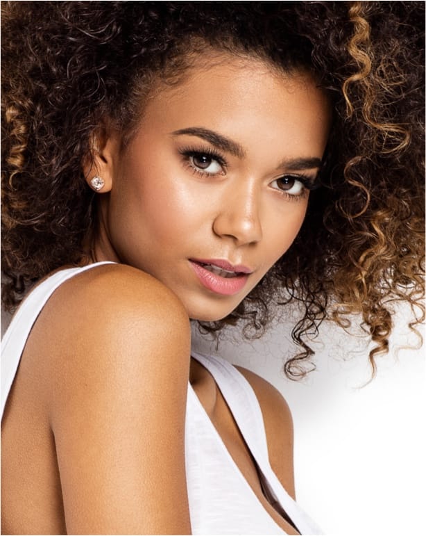 Woman with curly brown hair